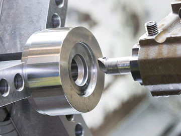 A CNC lathe cutting tool machining a workpiece - part of Glassworks' precision CNC machining services
